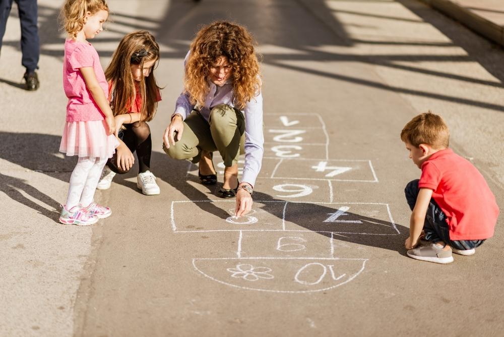 Drawing hopscotch in chalk